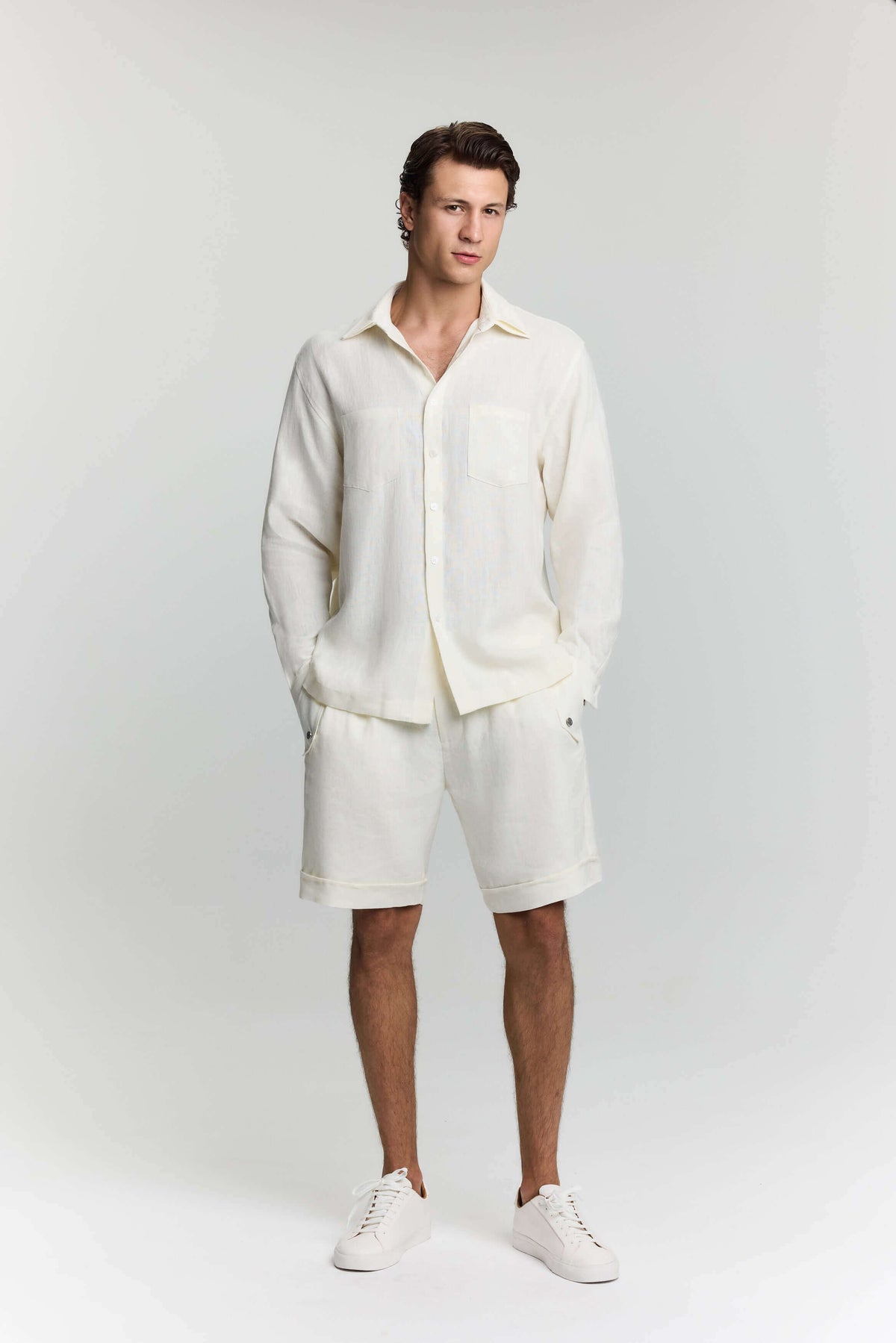 JENDUE Men Collection - Stylish & Modern Wear featuring a model in a cream outfit with shorts and white shoes.