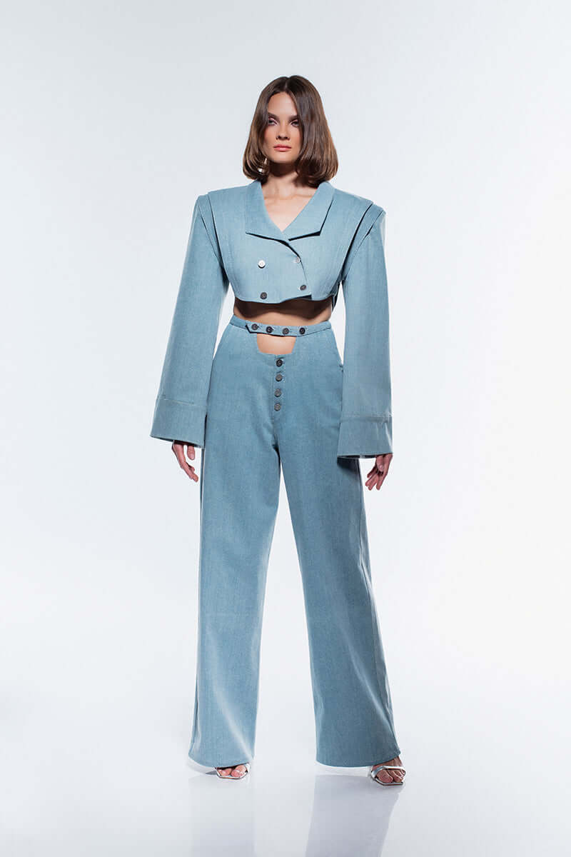 JENDUE Stormbringer wide-leg denim jeans in a solid ice blue color. The alt text highlights the button detailing at the front and the smooth, wide-cut of the leg for a relaxed fit.