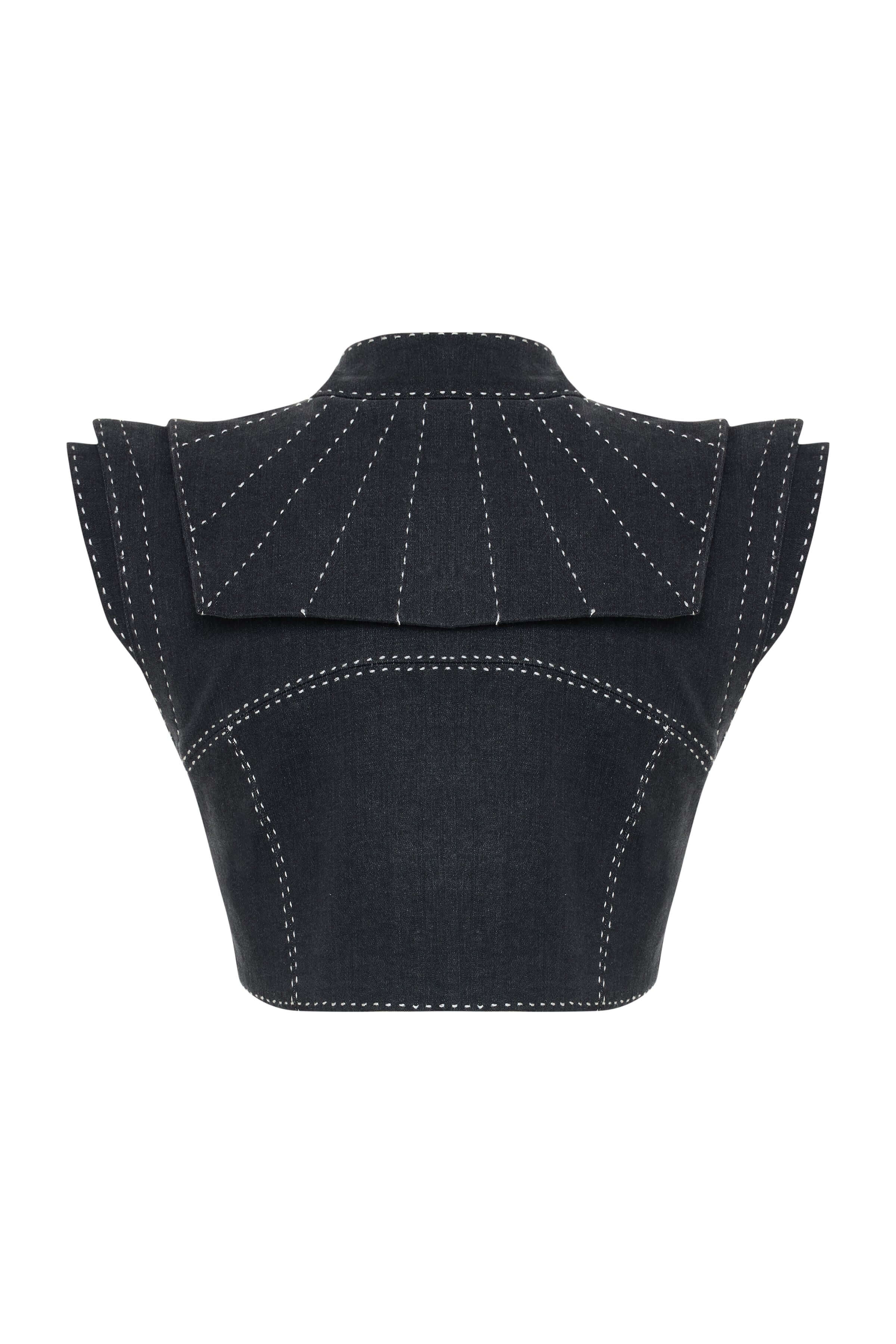 Navy blue denim crop top with a cutout neckline and front opening, detailed with striking white embroidery.