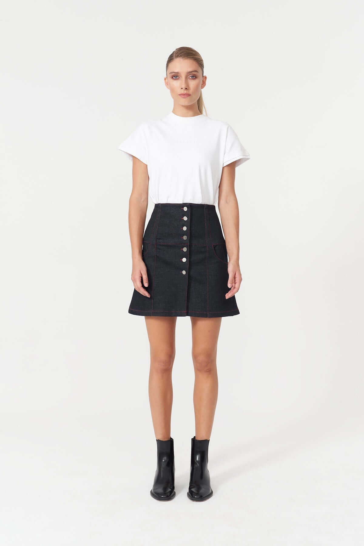 JENDUE's "Chaby" blue mini skirt, offering a modern A-line silhouette for versatile styling.