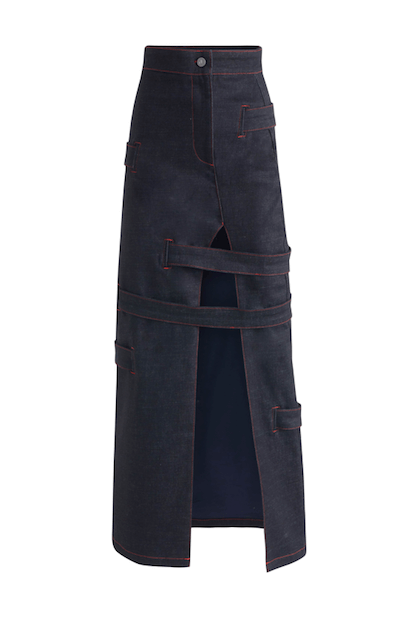 JENDUE blue denim maxi skirt: high-slit, strappy, with bold red contrast stitching.