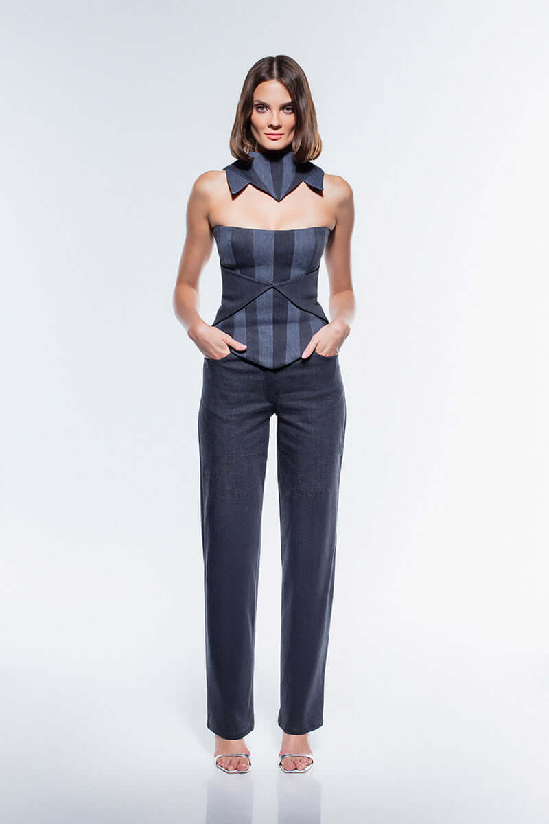 A stylish, dark-wash denim corset top with alternating dark and light gray stripes. It features a structured, strapless design and a pointed hem. A matching high-collar piece is shown above it.