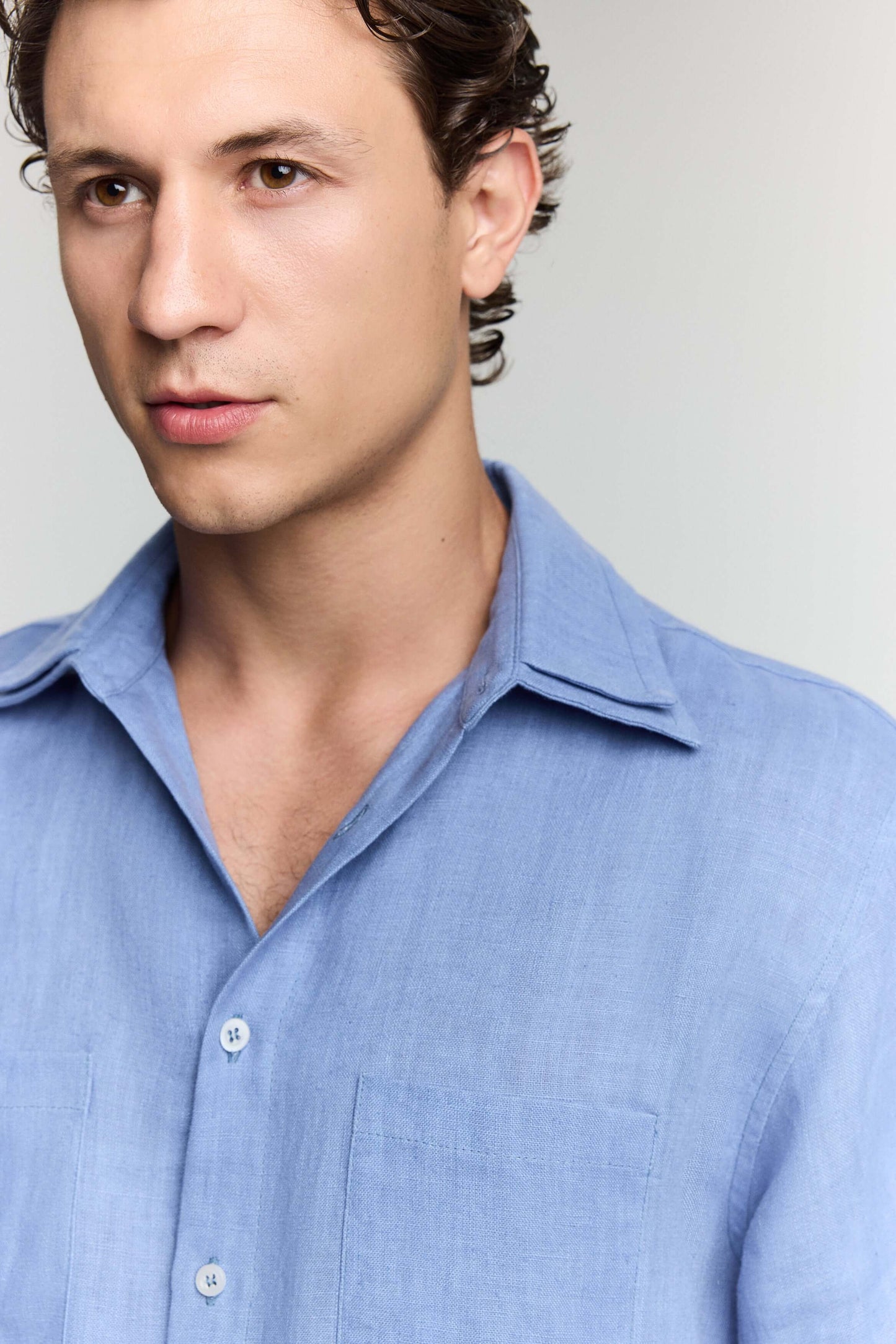 Refreshing blue denim linen shirt, versatile for layering, with a lightweight breathable design.