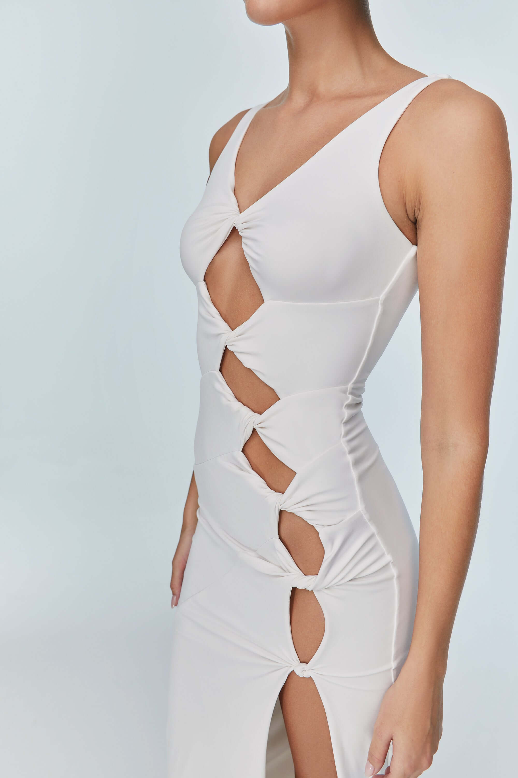 JENDUE's "Sara" white denim dress, perfect for resort or event wear, with a modern design.