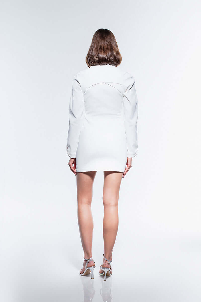 Fitted white dress with a unique high neckline, metal button details, voluminous sleeves, and a subtle slit.