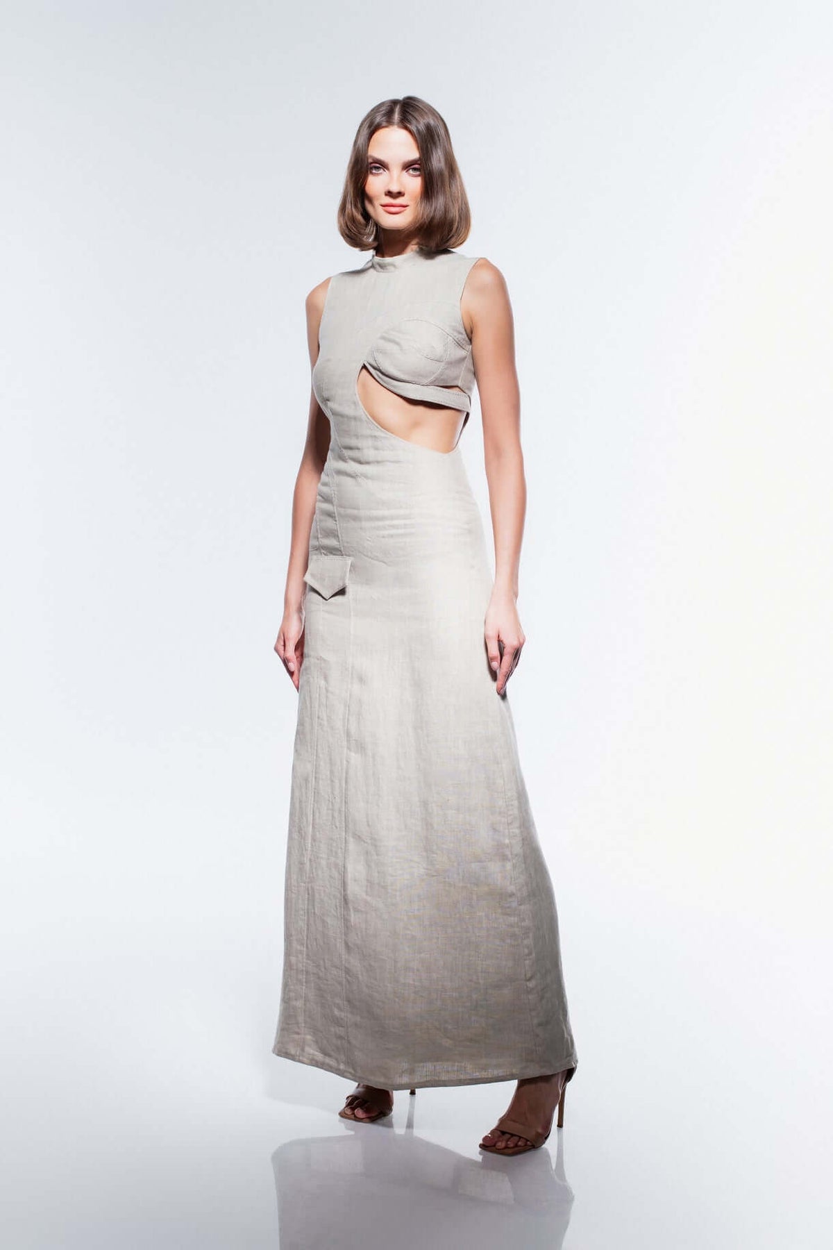 Model wearing JENDUE Soul Flame Dress - Avant-Garde Linen Maxi Cut-Out showcasing modern luxury and contemporary design.
