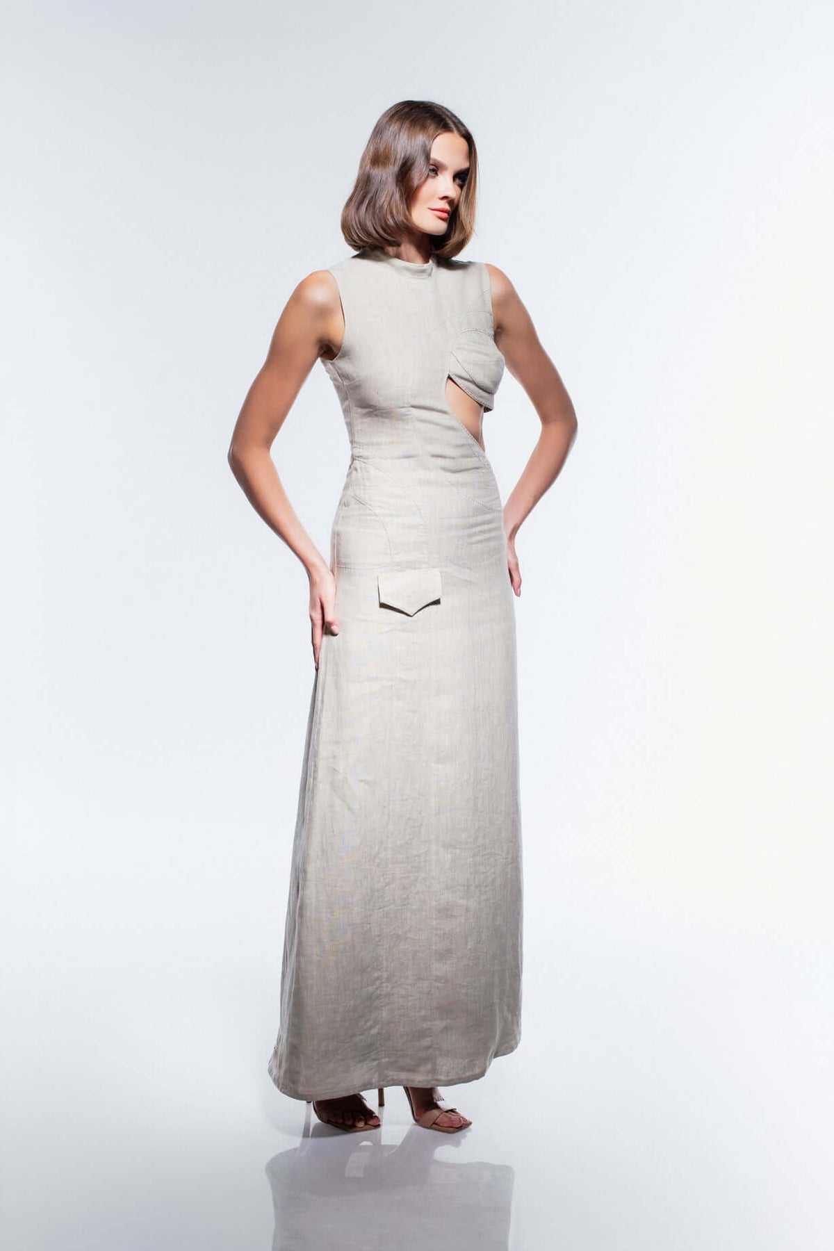 Model wearing the JENDUE Soul Flame Dress - Avant-Garde Linen Maxi Cut-Out, showcasing contemporary fashion elegance.