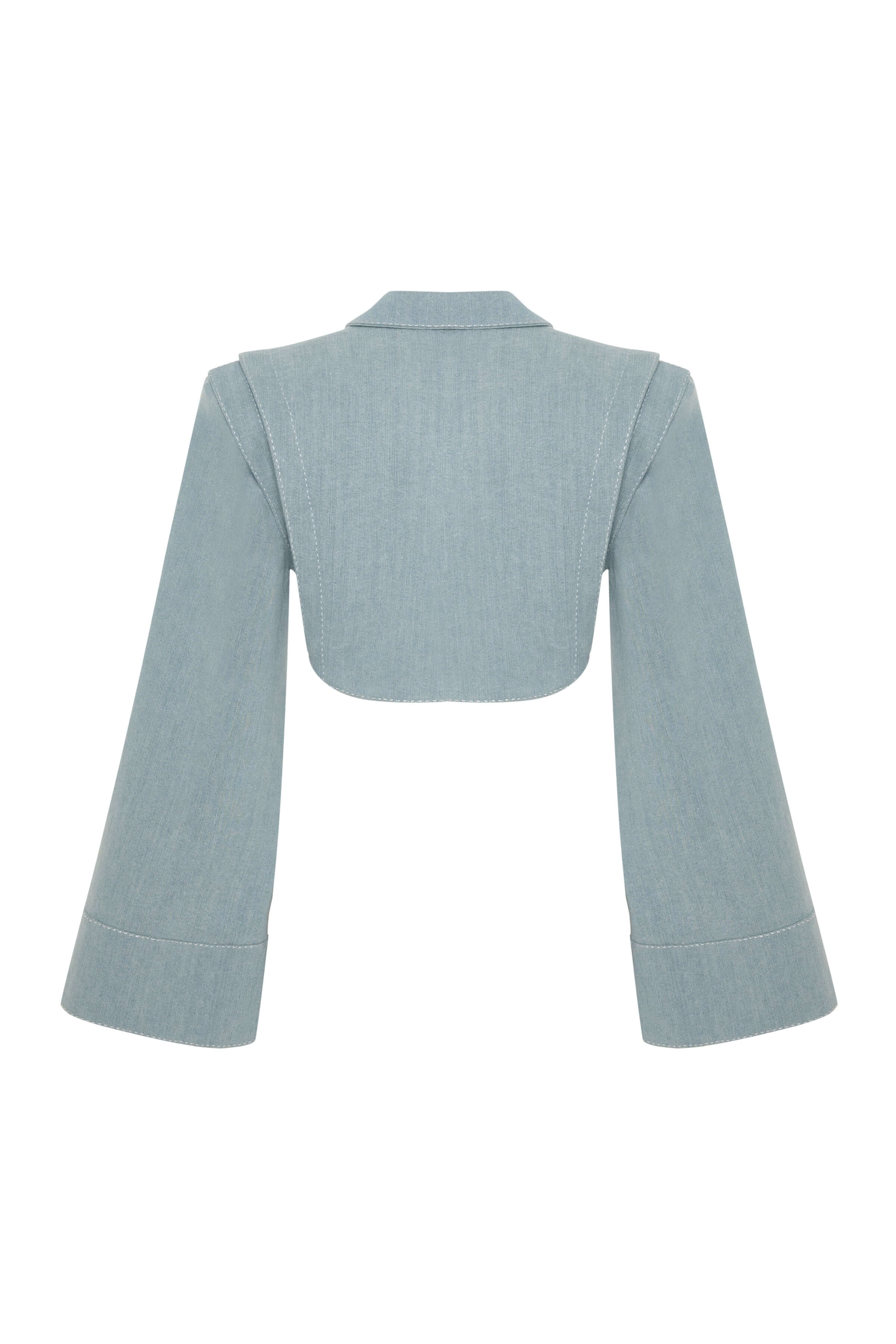 JENDUE Stormbringer jacket in ice blue. It's a structured, cropped denim piece with wide sleeves, strong shoulders, and an off-center button closure.