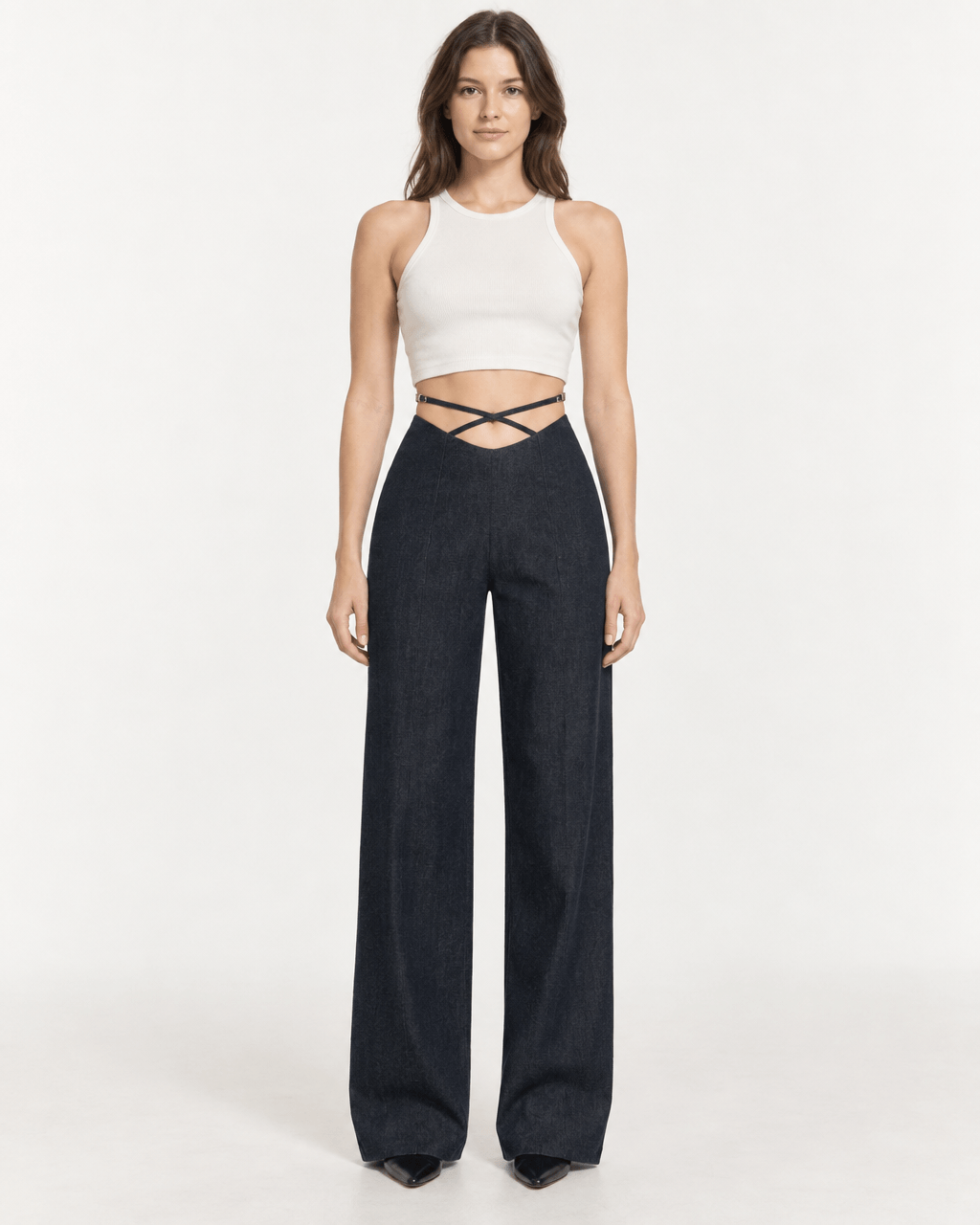 JENDUE Stella Trousers - High-Waist Criss-Cross Denim Pants worn by a model in a stylish pose.
