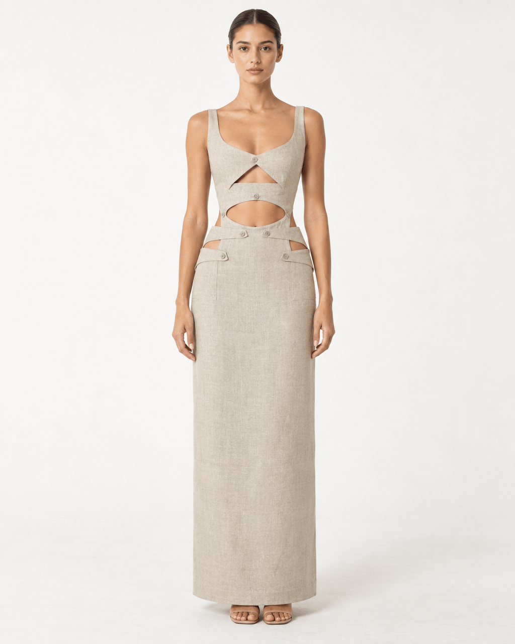 JENDUE Chiara Dress - Linen Cut-Out Maxi Dress worn by a model showcasing its unique design and natural fabric.