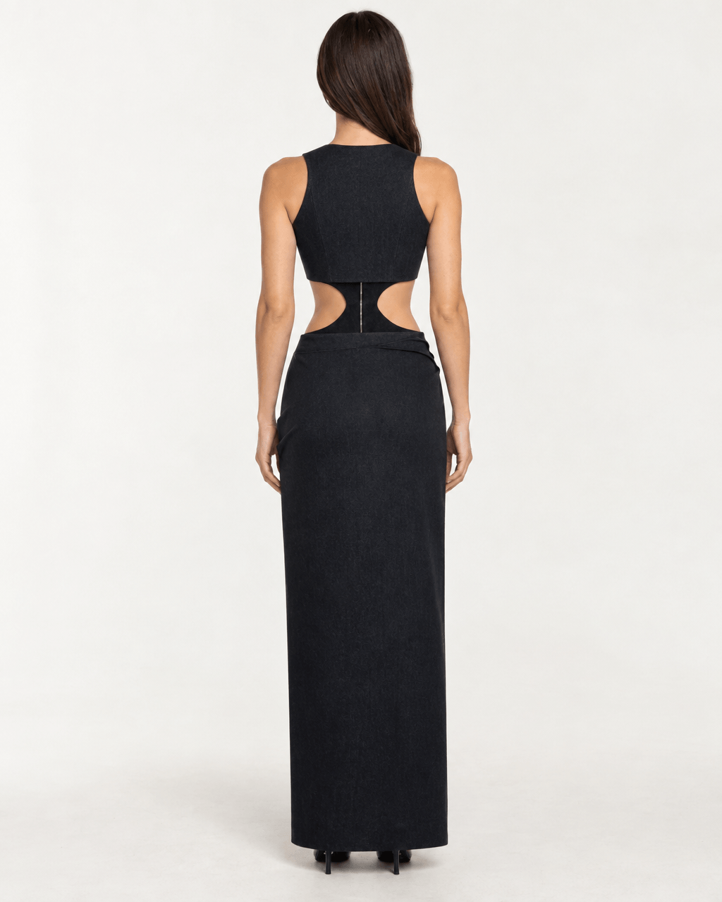 Back view of JENDUE Maia Dress - Black Denim Cut-Out Maxi Dress, featuring stylish cut-outs and a long silhouette.