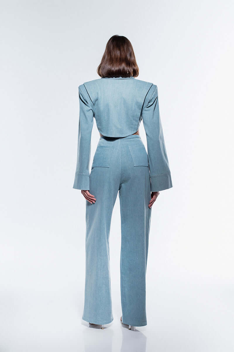 A pair of JENDUE Stormbringer ice blue denim jeans, showcasing a modern wide-leg silhouette. The distinctive high-waisted waistband and front button fly are visible against the white background.