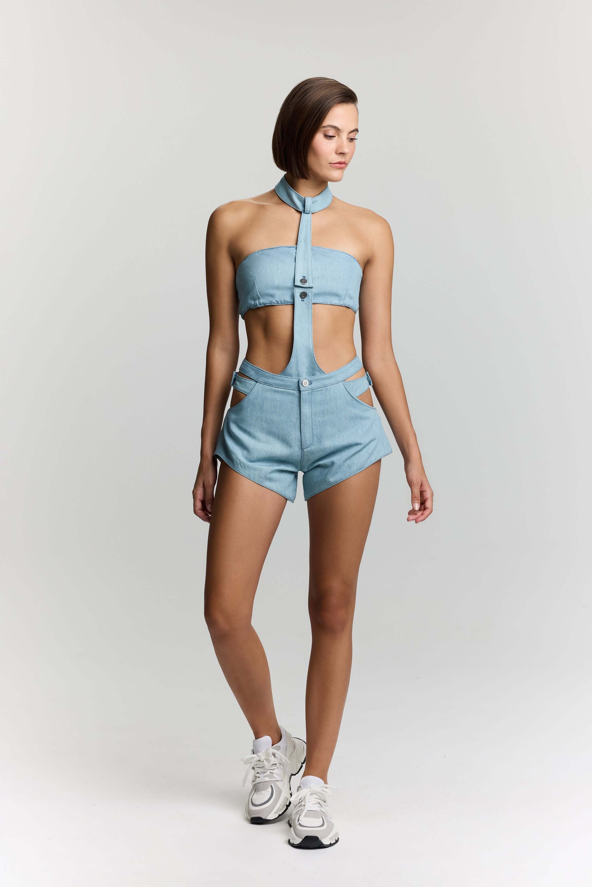 JENDUE Trendy light blue shorts: playful cut-outs, a high rise, and a unique, contemporary silhouette.