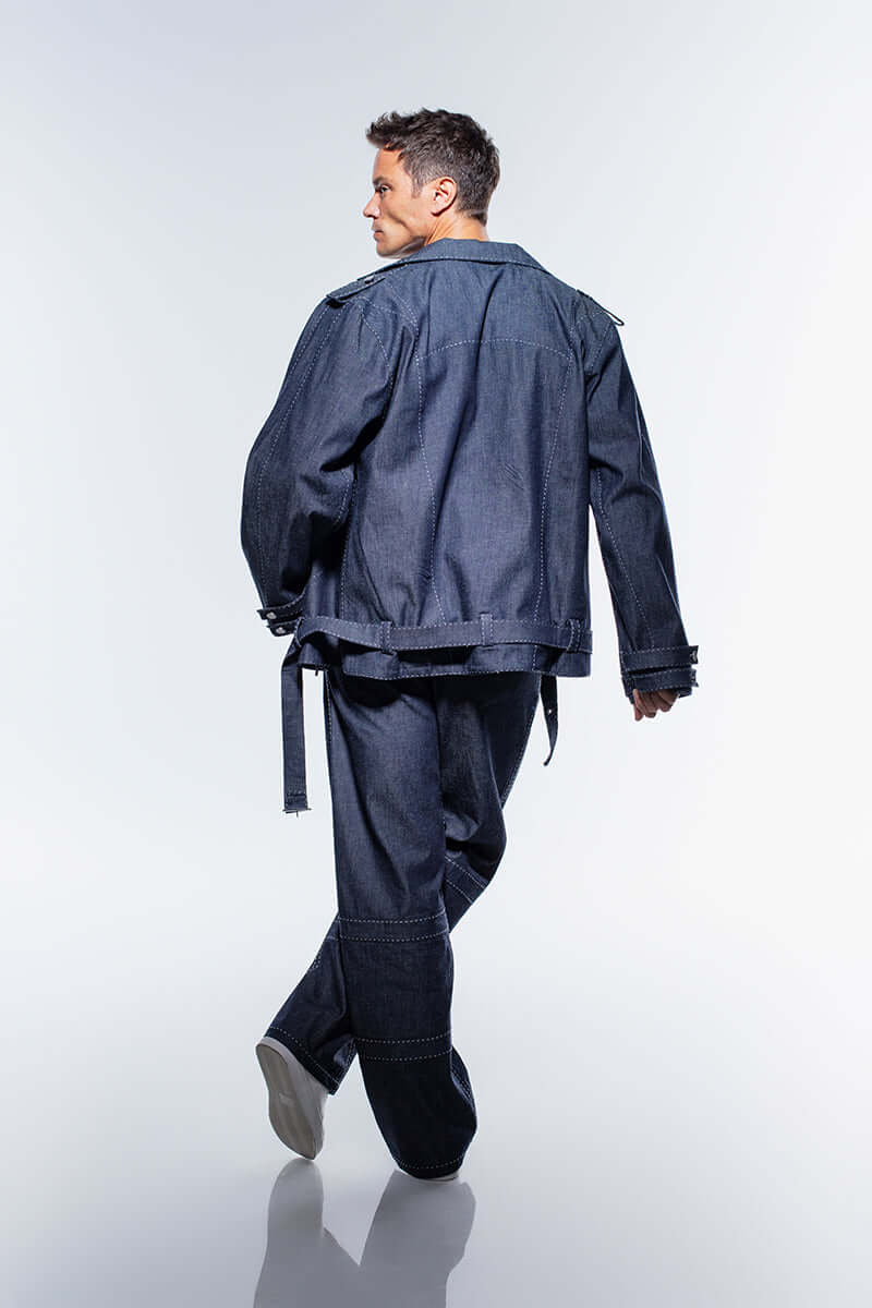 Men's navy blue denim jacket, JENDUE Fortidude, with white stitching, two buttoned chest pockets, and a zippered front.