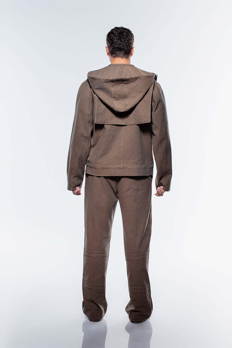 Stylish brown denim jacket featuring a double-zipper front closure and four distinct, rectangular pockets on the chest.