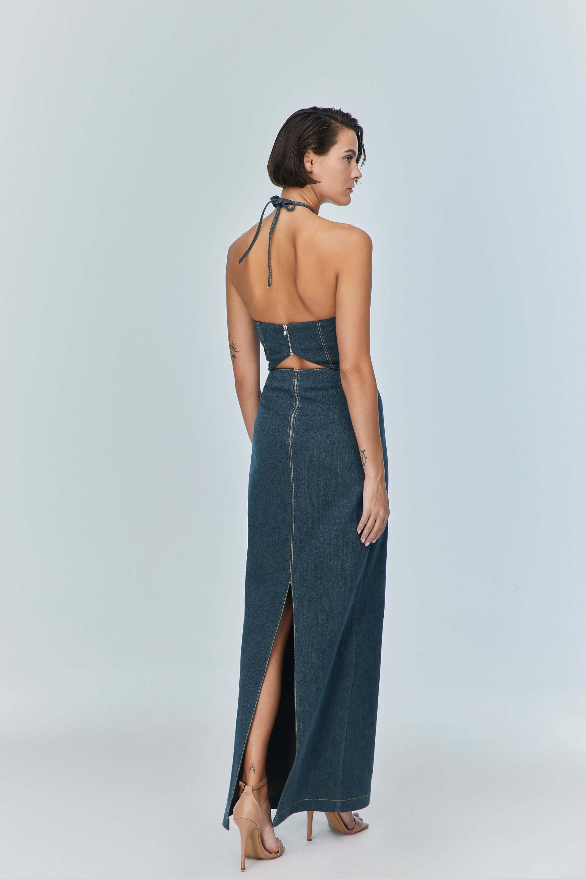 JENDUE trendy blue denim maxi dress: fitted bodice, flowing skirt, and a unique cutout design.