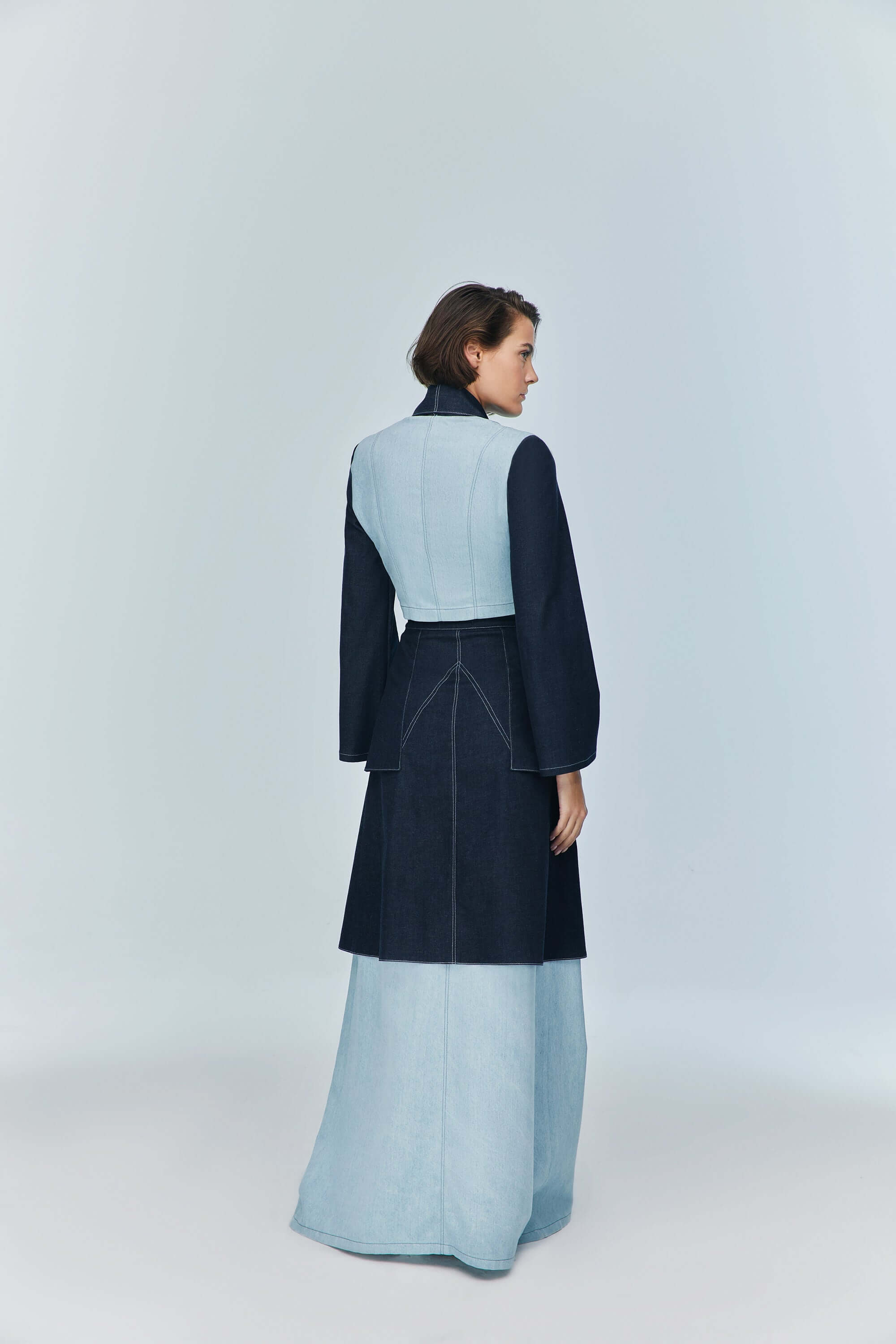JENDUE fashionable blue denim skirt: ankle length, with a raw hem and distinct color blocking.