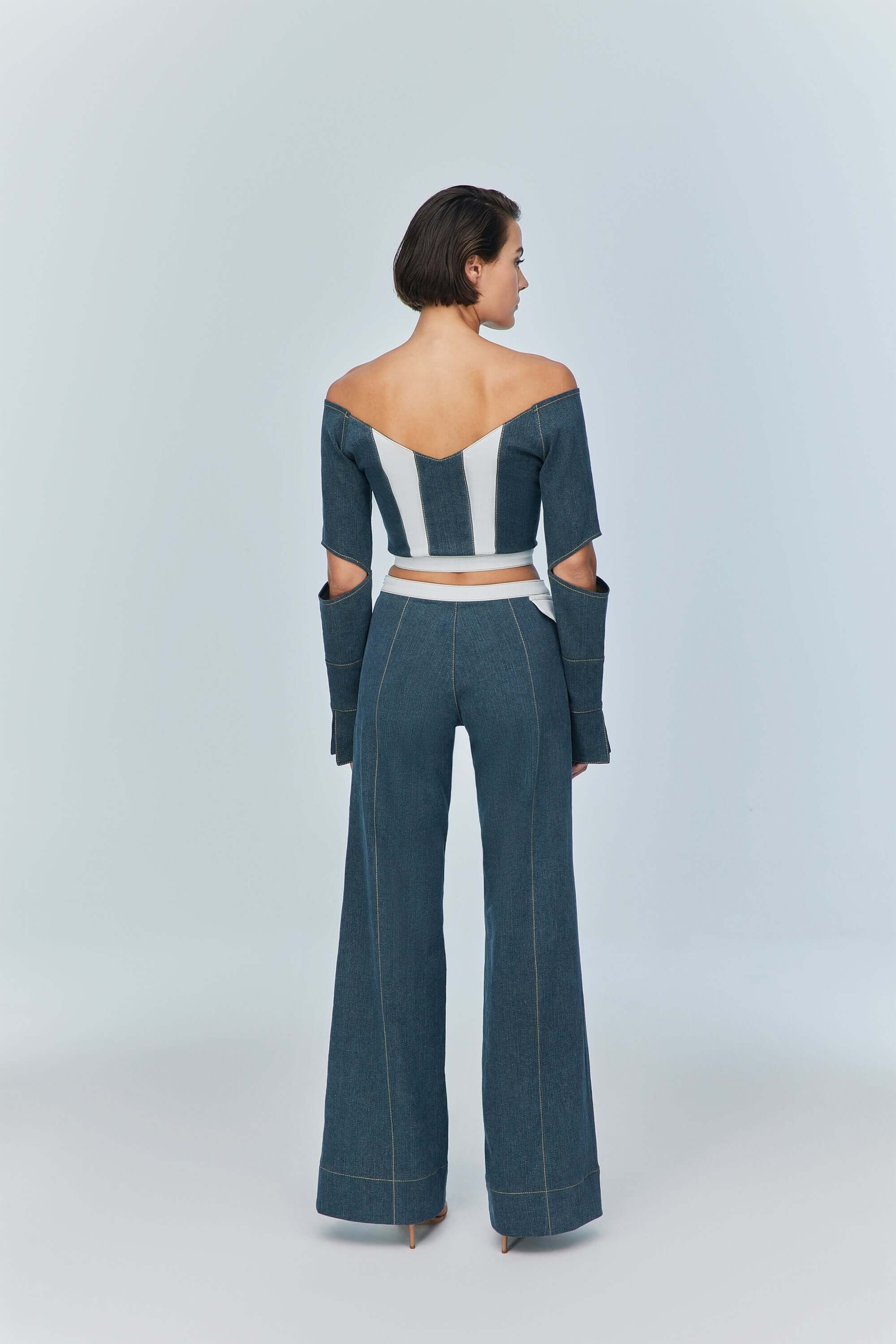 JENDUE trendy blue denim jacket with a wide, open neckline, ideal for showcasing shoulders.
