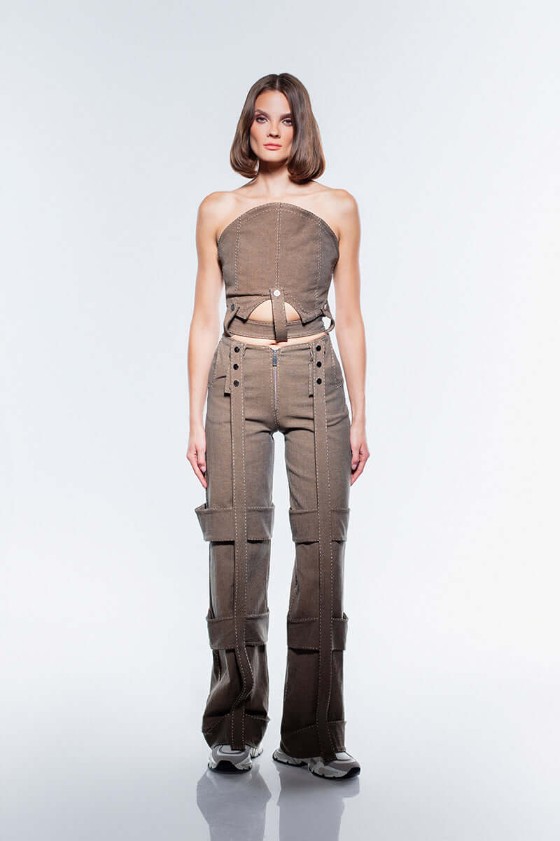 Brown JENDUE Wild Flower Denim Jeans with wide, double-strapped leg detailing and eyelets on the high waist.